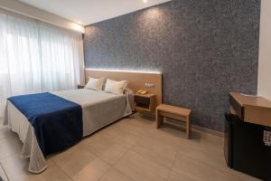 Un pat sau paturi într-o cameră la Hotel Montemar *** Superior