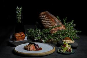 a table with a plate of pastries and a basket at Forest Side Hotel in Grasmere