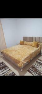 a large bed sitting in a room with at Residence djerba 4 in Houmt Souk