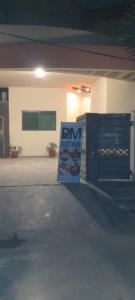 een bord voor een gebouw met een bm check house bij R.M RESIDENCY in Lahore