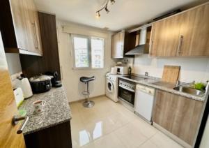 a kitchen with a sink and a stove at Romantik M in Sucina