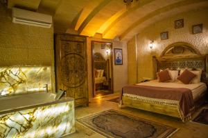 Postelja oz. postelje v sobi nastanitve Garden Suites Hotel Cappadocia