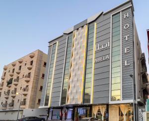 a building with a sign on the side of it at Abela Al Hamra - Palestine Street in Jeddah