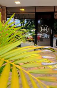 a green plant in front of a building at Hotel Hellyus in Brasilia