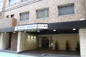 a building with a hotel kasyatown sign on it at Hotel Kansai in Osaka