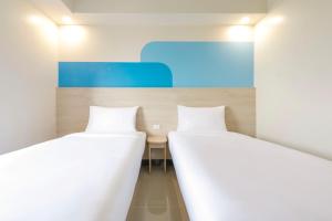 Lova arba lovos apgyvendinimo įstaigoje Hop Inn Hotel Iloilo