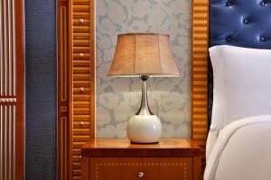 A bed or beds in a room at The Ritz-Carlton Jeddah