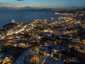 eine Luftansicht einer Stadt in der Nacht in der Unterkunft Asty Mykonos Hotel & Spa - World of One Hotel Group in Mykonos Stadt