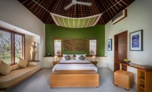 A bed or beds in a room at Villa Sabandari