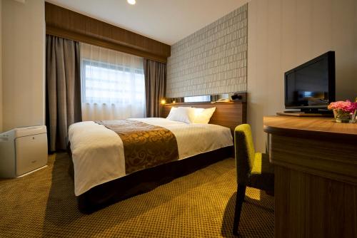 En eller flere senger på et rom på Sendai Kokusai Hotel