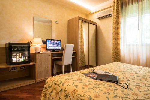 เตียงในห้องที่ Hotel Vega Perugia