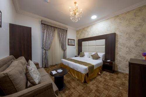 Ліжко або ліжка в номері Jasmine Beach Hotel Suites
