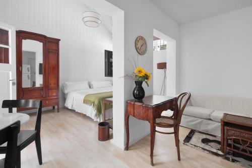 Säng eller sängar i ett rum på La Petite Maison San Isidro