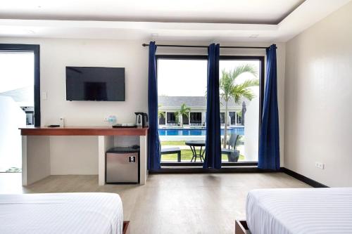 Postelja oz. postelje v sobi nastanitve OHANA, Panglao Resort.