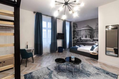 a bedroom with a bed and a desk and a table at Catalog Boutique Rooms in Debrecen