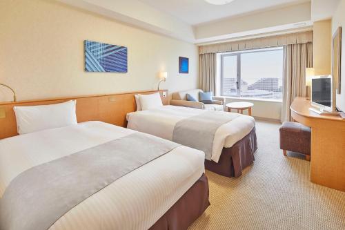 เตียงในห้องที่ Hotel Emion Tokyo Bay