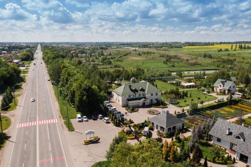 an aerial view of a town with a road and houses at Рестпарк рекреаційний комплекс in Lutsk