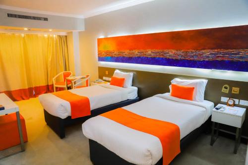 Кровать или кровати в номере Citymax Hotel Aswan