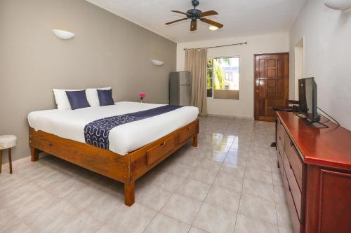 Giường trong phòng chung tại Hotel Kiin Cozumel