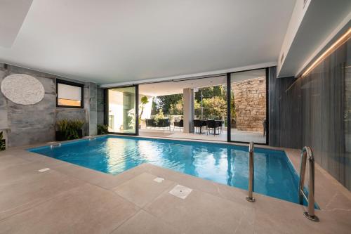 a large swimming pool in a house at Hotel Cittar in Novigrad Istria