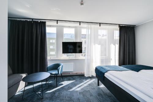 A bed or beds in a room at Hotel Fridhem