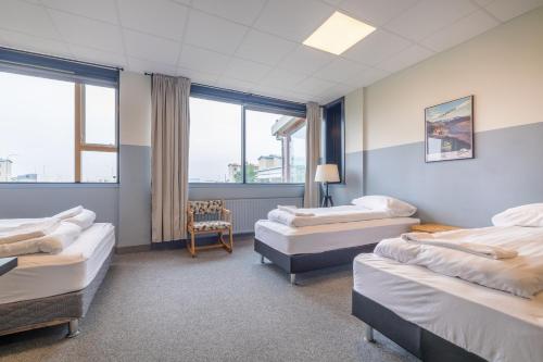 A bed or beds in a room at ABC Hotel by Reykjavik Keflavik Airport