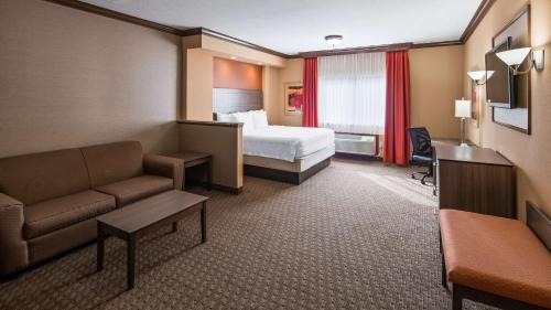 A bed or beds in a room at Best Western Plus North Canton Inn & Suites