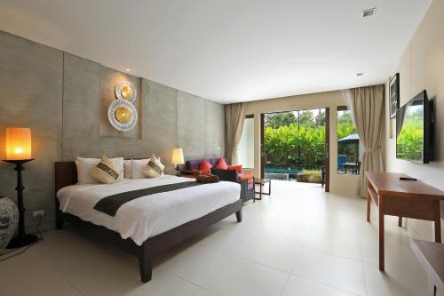 Tempat tidur dalam kamar di Tea Tree Boutique Resort