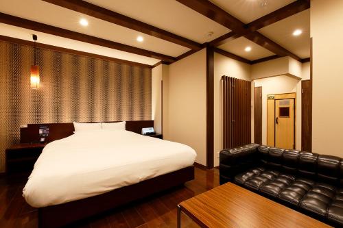 HOTEL 555 Airにあるベッド