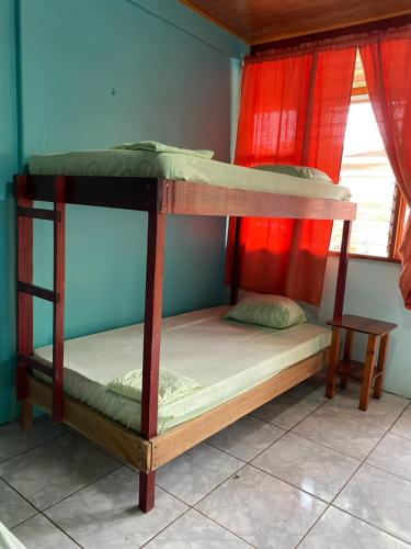 A bed or beds in a room at Cabinas Popular