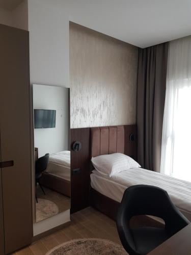 Кровать или кровати в номере MY HOTEL