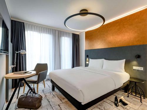 Giường trong phòng chung tại ibis Styles Bamberg