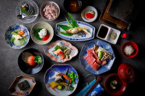 a group of plates of food on a table at Busuitei in Hida