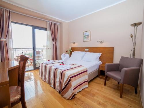 Posteľ alebo postele v izbe v ubytovaní Hotel Petrovac