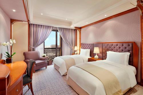 A bed or beds in a room at The Ritz-Carlton Jeddah