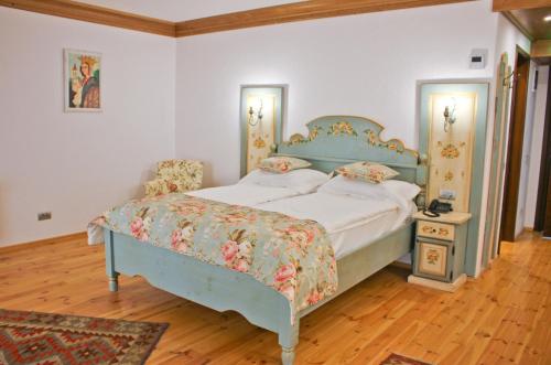 מיטה או מיטות בחדר ב-Casa Comana Boutique Hotel