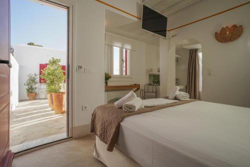 Voodi või voodid majutusasutuse 23 Hotel Mykonos toas