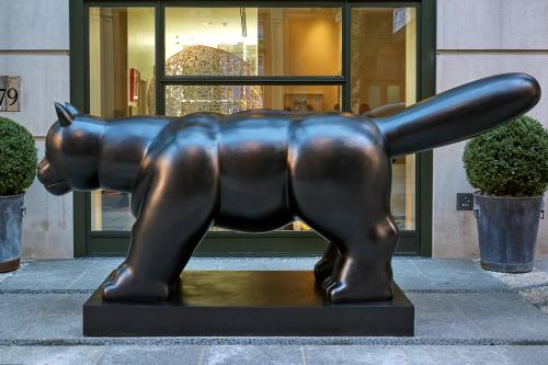 a statue of a bear in front of a building at Crosby Street Hotel in New York