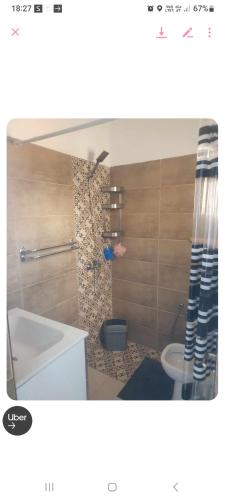 a bathroom with a sink and a toilet in a room at Residence djerba 4 in Houmt Souk