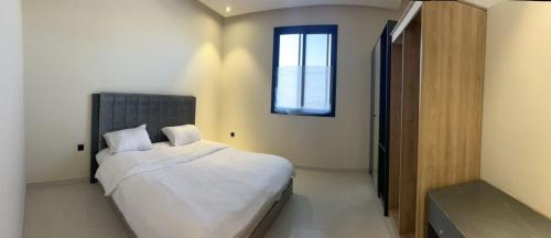 Tempat tidur dalam kamar di Al Azmy Al Ared Hotel