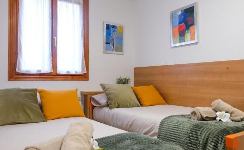 Ліжко або ліжка в номері APARTAMETO BAZTANGOA I