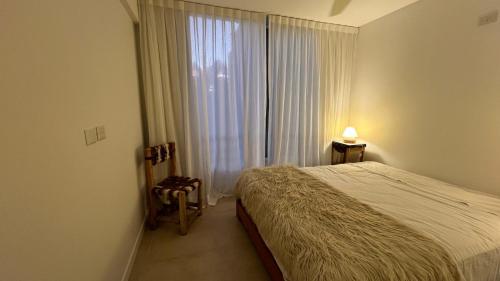 En eller flere senge i et værelse på Luminoso departamento con cochera en San Isidro