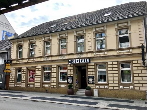 a building with a sign on the front of it at Hotel Schwaferts in Wuppertal