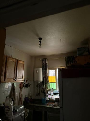 a kitchen with a ceiling fan in a room at appart charaf in Taza