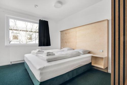 A bed or beds in a room at Sleepcph