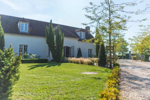 A garden outside Domaine de Bellevue, The Originals Relais