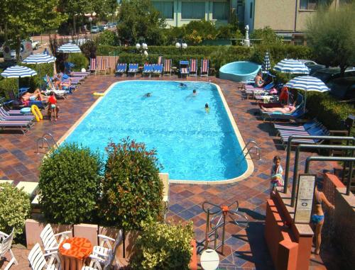 an overhead view of a swimming pool with people in it at Hotel Prestigio in Cesenatico