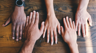 four hands of different color