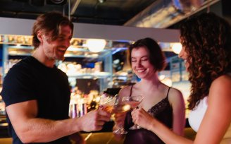 Group of friends toasting with drinks