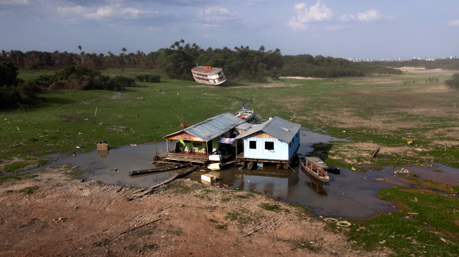 October 4, 2023: An aerial view of the drought-hit harbor of Cacau Pirêra, where houses that normally float on the water are lying on the river bed in Iranduba, Amazonas, Brazil. October 2023 was the world’s — and South America’s — warmest October on record.